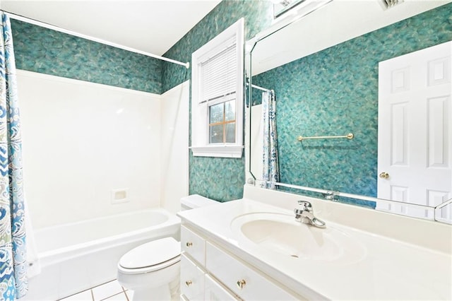 full bathroom featuring tile patterned flooring, vanity, toilet, and shower / tub combo with curtain