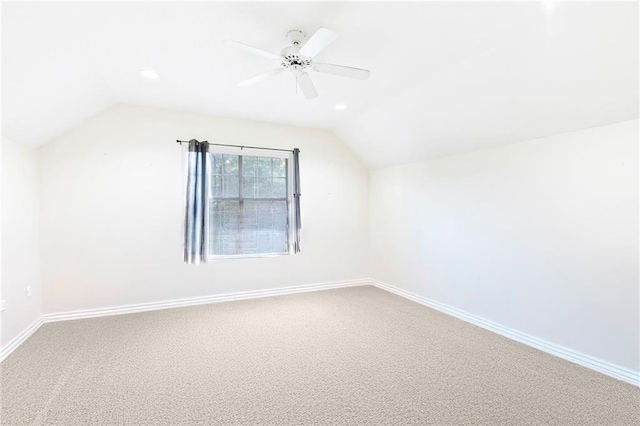 additional living space with carpet flooring, ceiling fan, and lofted ceiling