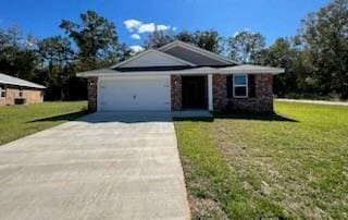 view of front of house with a front yard and a garage