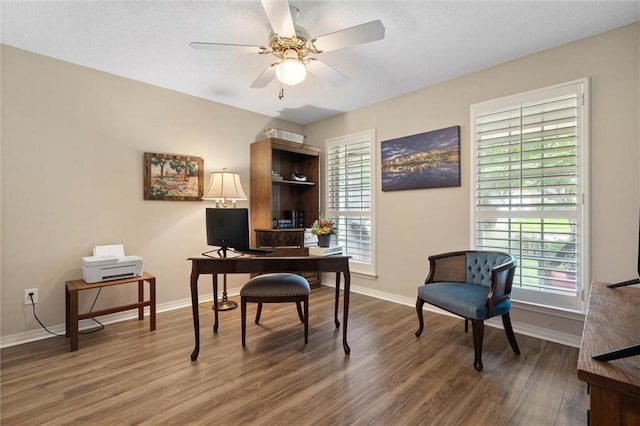 1045 Cross Gates Pl, Mobile, AL 36609 - home office with wood finished floors, a ceiling fan, and a textured ceiling