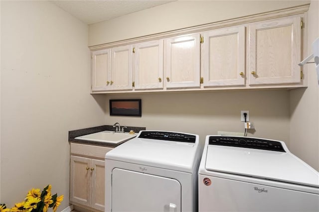 1045 Cross Gates Pl, Mobile, AL 36609 - laundry area with washer and dryer, cabinet space, and a textured ceiling
