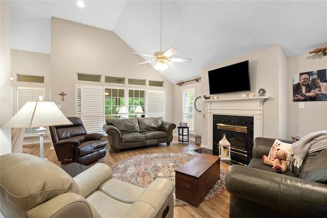 1045 Cross Gates Pl, Mobile, AL 36609 - living area with high vaulted ceiling, a ceiling fan, wood finished floors, and a fireplace