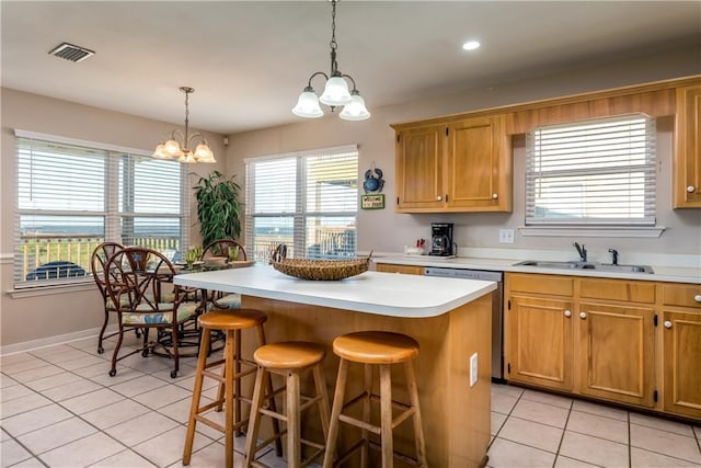 2354 Island Shores Dr, Dauphin Island, AL 36528 - kitchen featuring light tile patterned flooring, visible vents, a notable chandelier, and a sink