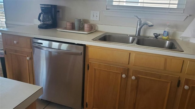 2354 Island Shores Dr, Dauphin Island, AL 36528 - kitchen with light countertops, brown cabinetry, stainless steel dishwasher, and a sink