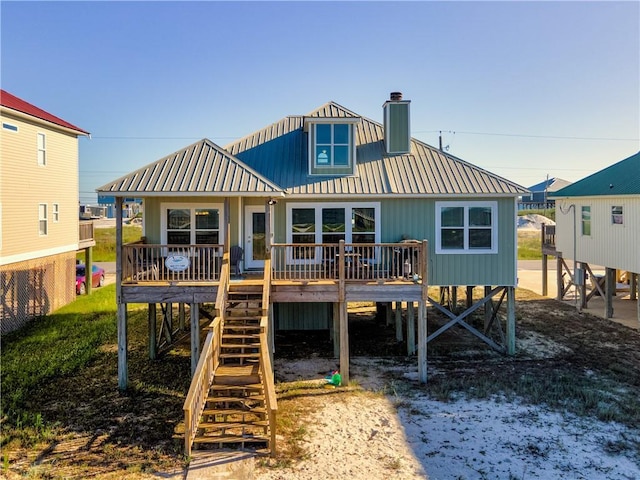 2354 Island Shores Dr, Dauphin Island, AL 36528 - back of house with a chimney, stairs, metal roof, and a deck