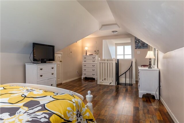 2354 Island Shores Dr, Dauphin Island, AL 36528 - bedroom with vaulted ceiling, baseboards, and dark wood-type flooring