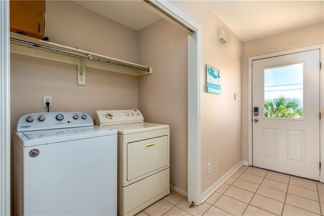 2354 Island Shores Dr, Dauphin Island, AL 36528 - laundry area featuring baseboards, washer and dryer, and light tile patterned floors