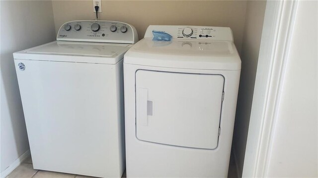 2354 Island Shores Dr, Dauphin Island, AL 36528 - laundry area featuring washing machine and clothes dryer, laundry area, and light tile patterned floors