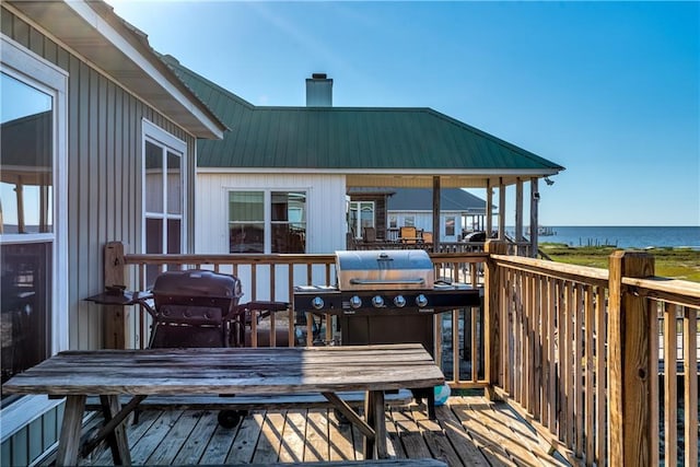 2354 Island Shores Dr, Dauphin Island, AL 36528 - wooden terrace with grilling area and a water view