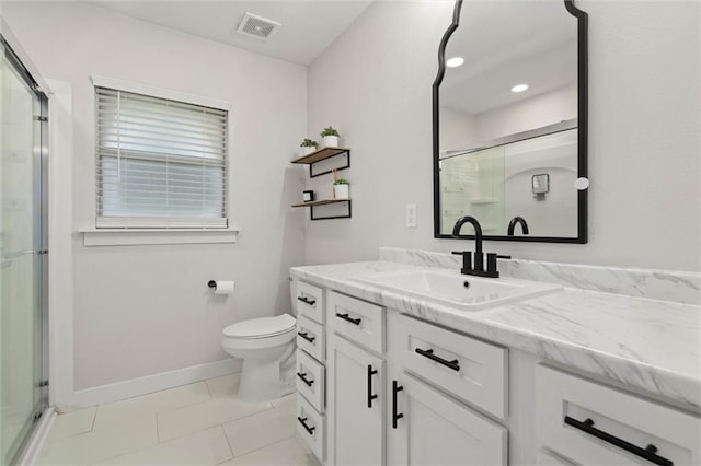 254 Fairford Rd, Calvert, AL 36513 - bathroom featuring vanity, a shower stall, tile patterned flooring, and recessed lighting