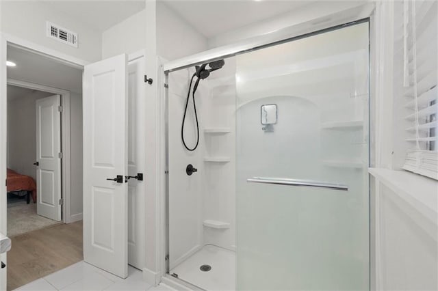 254 Fairford Rd, Calvert, AL 36513 - ensuite bathroom with a stall shower and wood finished floors