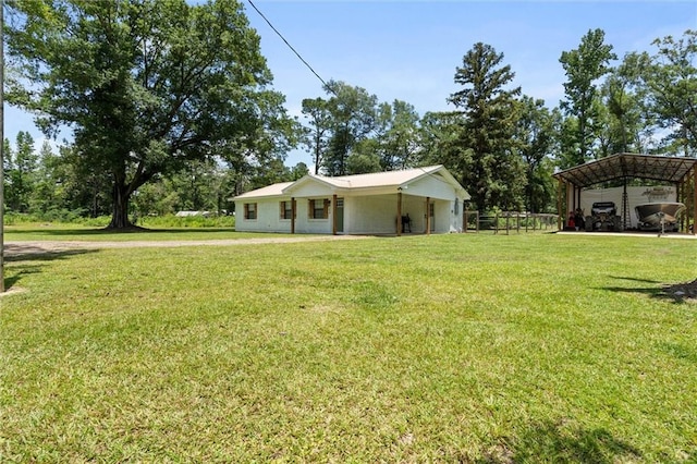 254 Fairford Rd, Calvert, AL 36513 - view of green lawn with a detached carport