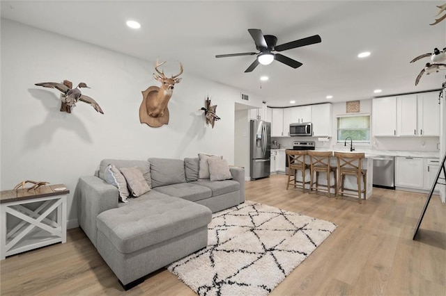254 Fairford Rd, Calvert, AL 36513 - living room featuring light wood-style floors, ceiling fan, and recessed lighting