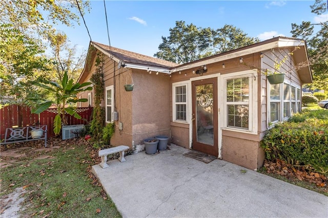 rear view of house with a patio