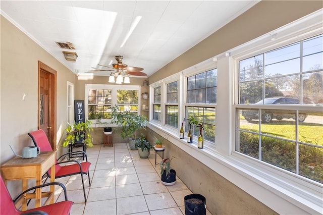 sunroom with ceiling fan and plenty of natural light