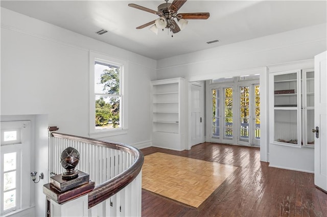 entrance foyer with dark hardwood / wood-style flooring and ceiling fan