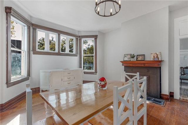 dining space featuring a notable chandelier and light hardwood / wood-style flooring