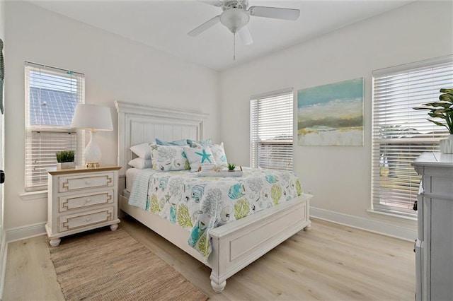 bedroom with light wood-type flooring and ceiling fan