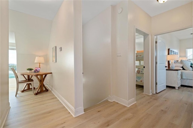 corridor with light wood-type flooring