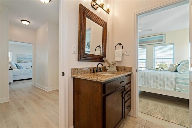 bathroom featuring vanity and hardwood / wood-style flooring