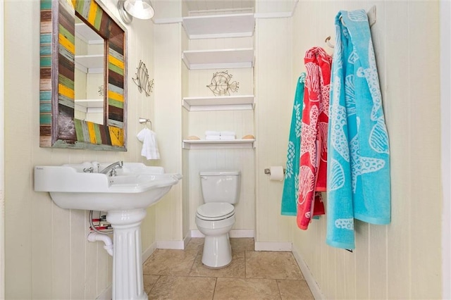 bathroom with tile patterned flooring and toilet