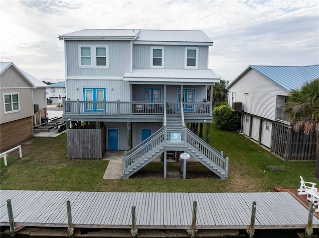 back of property featuring a yard