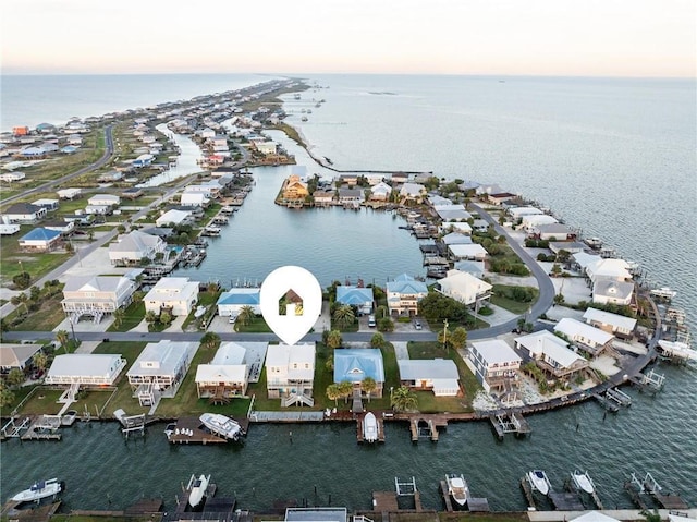 aerial view at dusk with a water view