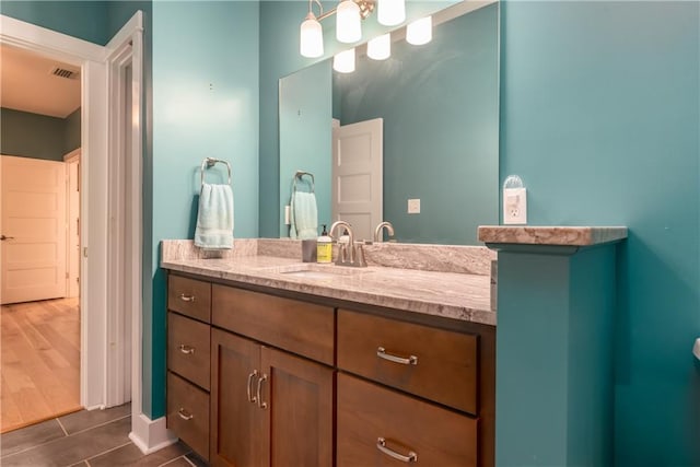 bathroom featuring vanity and wood-type flooring