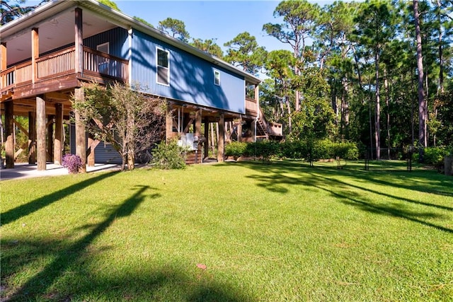 rear view of property with a yard