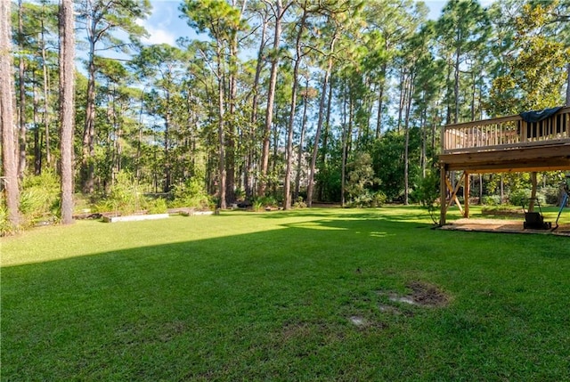 view of yard with a wooden deck