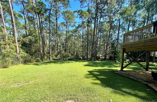 view of yard featuring a wooden deck