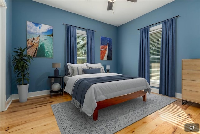 bedroom featuring ceiling fan and hardwood / wood-style flooring