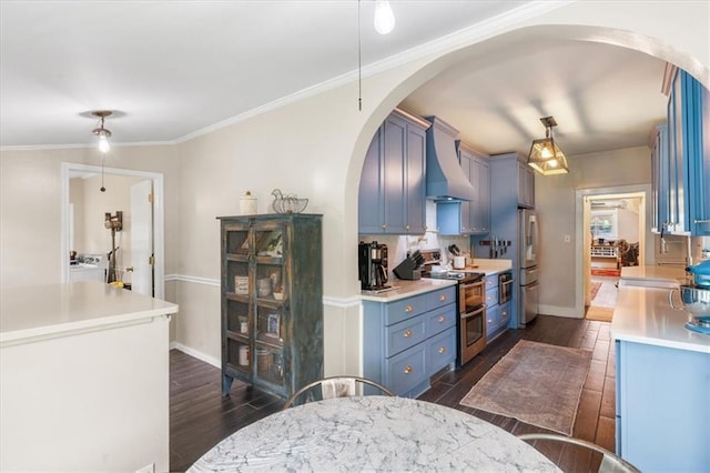 kitchen featuring arched walkways, custom exhaust hood, appliances with stainless steel finishes, dark wood-style flooring, and washer / clothes dryer