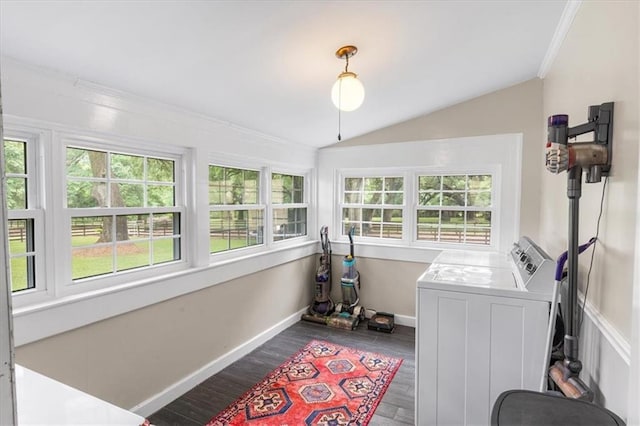 laundry room with wood finished floors, laundry area, washer and dryer, baseboards, and crown molding