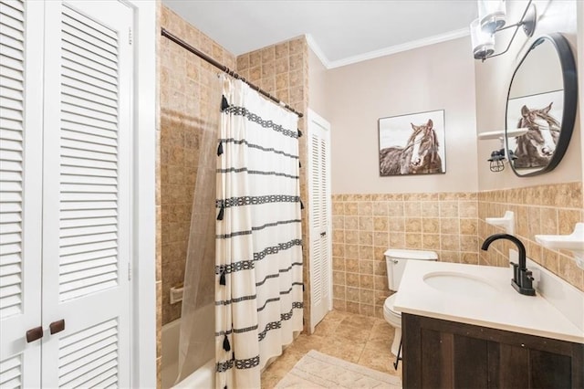 full bathroom with shower / tub combo, a closet, toilet, ornamental molding, and tile walls