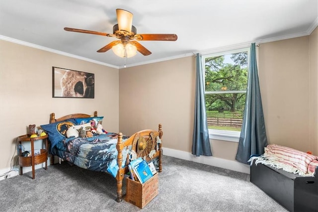 carpeted bedroom with crown molding, ceiling fan, and baseboards