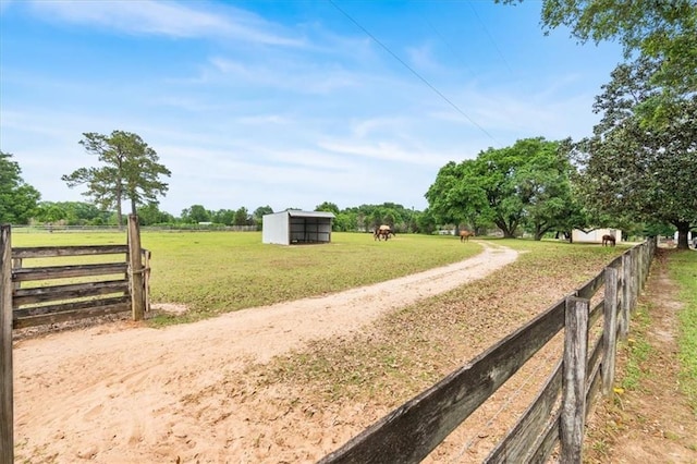 view of street featuring a rural view and dirt driveway