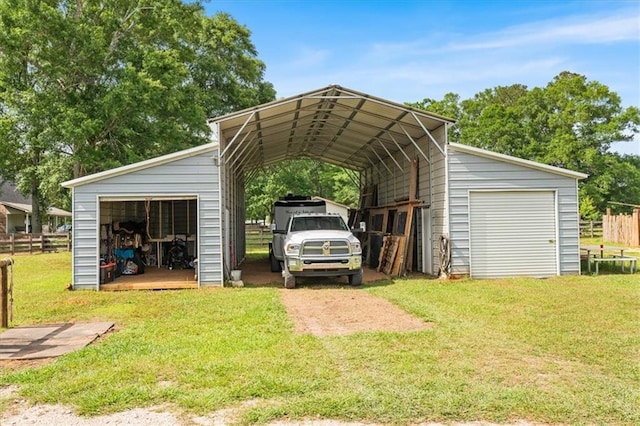 view of vehicle parking featuring a garage and fence