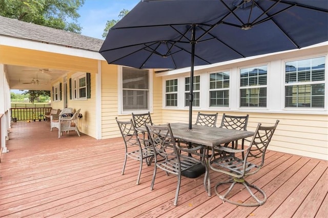 wooden terrace with outdoor dining space