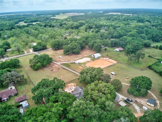 drone / aerial view featuring a view of trees