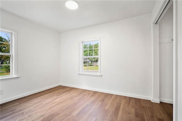 unfurnished bedroom featuring light wood-type flooring