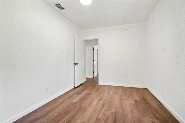 spare room with light wood-type flooring