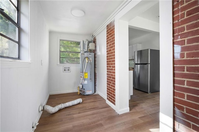 utility room featuring gas water heater