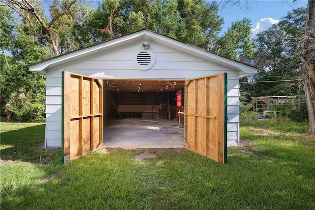 view of outbuilding with a lawn