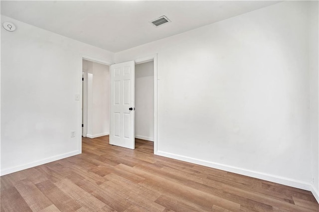 spare room featuring light wood-type flooring