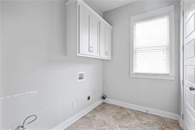 kitchen featuring ornamental molding, backsplash, white cabinetry, stainless steel appliances, and a kitchen breakfast bar