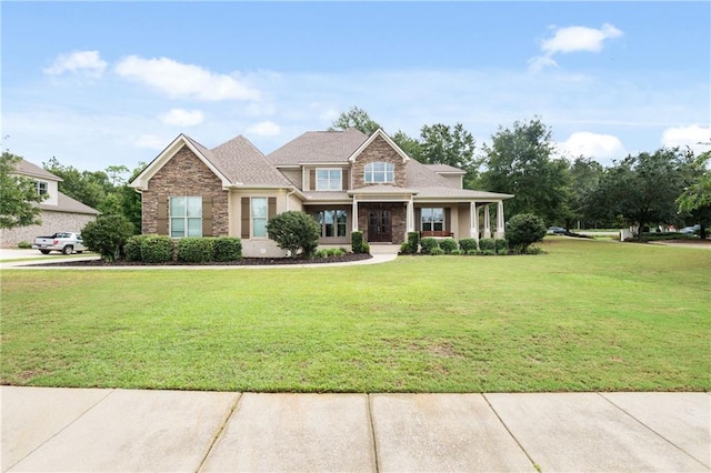 craftsman inspired home with a front yard