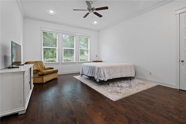 bedroom with ceiling fan, ornamental molding, and dark wood-type flooring