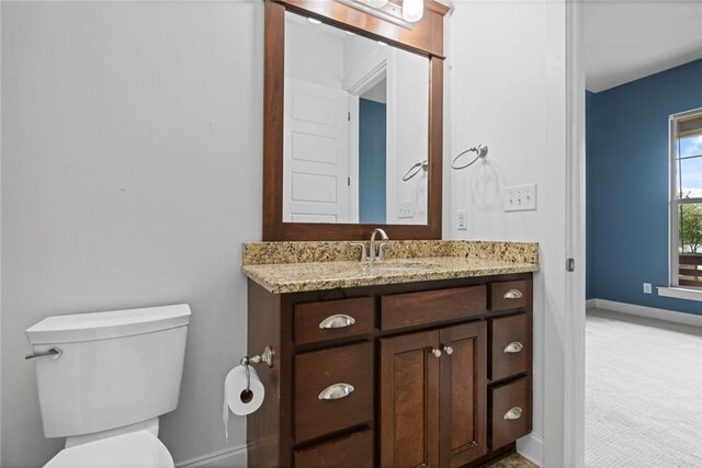 full bathroom featuring vanity, tiled shower / bath combo, toilet, and tile patterned flooring