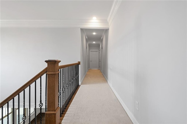 corridor featuring light colored carpet and ornamental molding